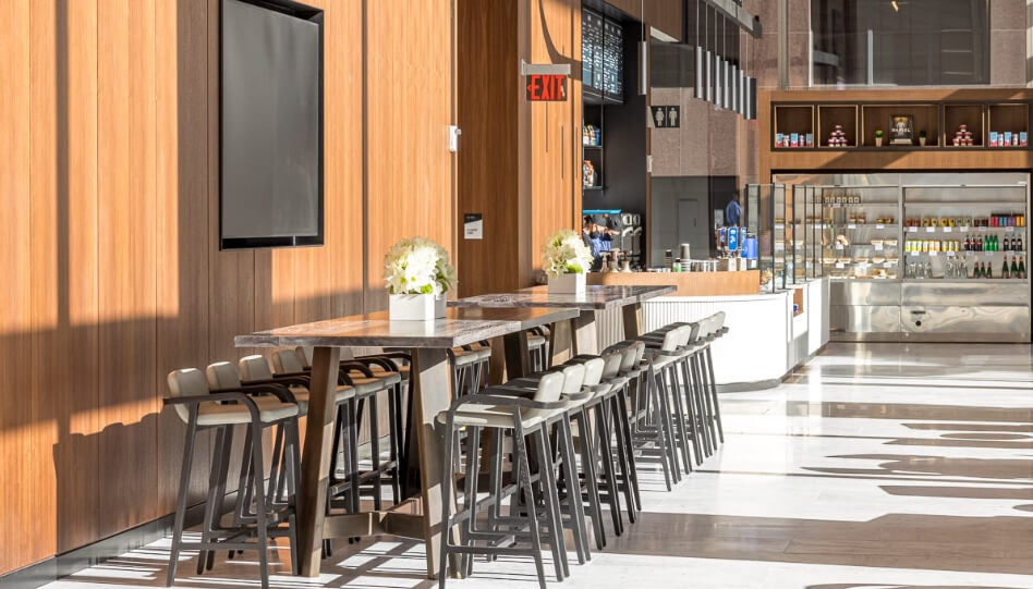 Cafe with a healthy building design, featuring natural wood accents and a bright, open seating area.