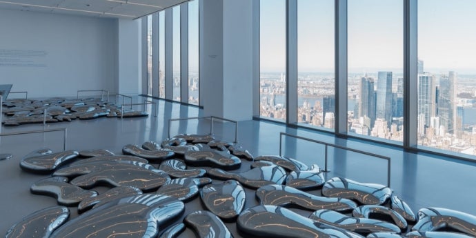 Reflect exhibit at SUMMIT One Vanderbilt with Yayoi Kusama's metallic 'Clouds' sculpture on the 91st floor.
