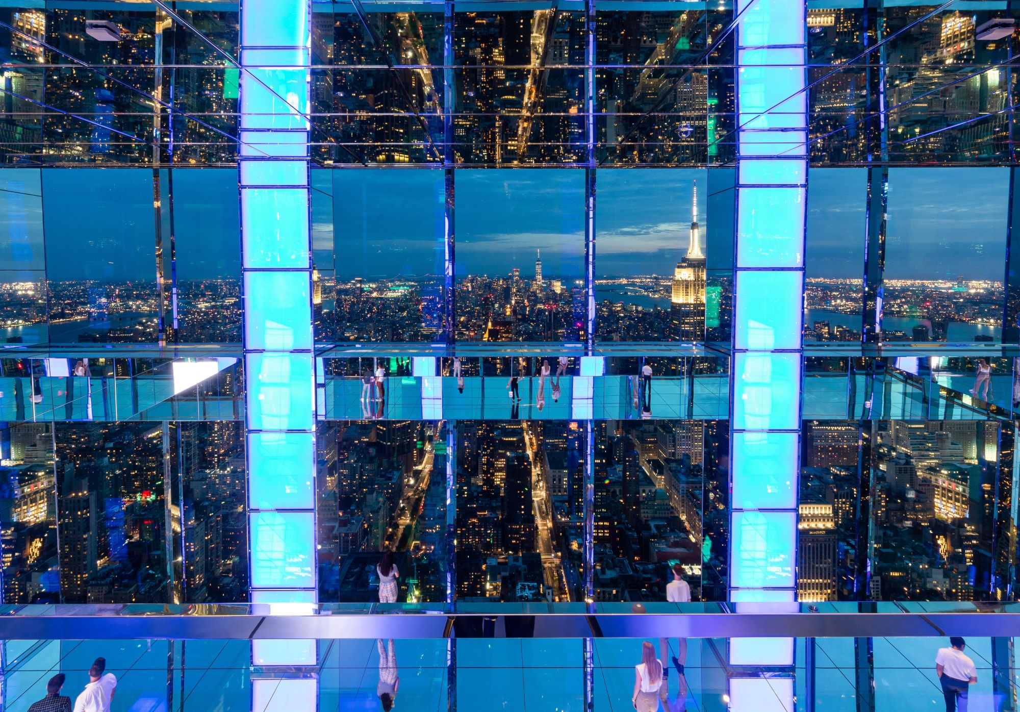 NYC night view from SUMMIT's mirrored deck, offering a unique experience for travel professionals' clients.