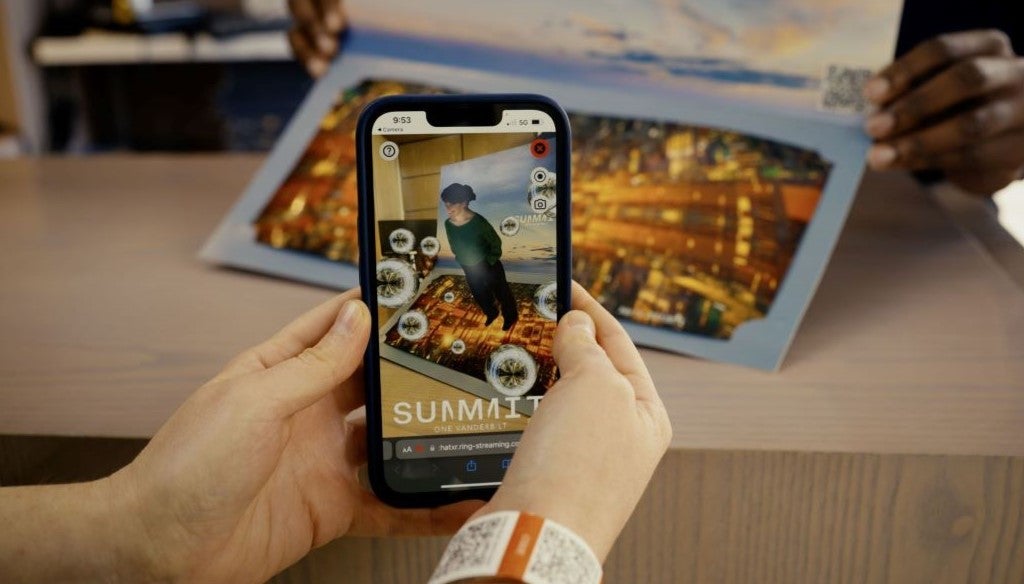 Person viewing their 3D hologram and panoramic photo from SUMMIT One Vanderbilt's Portal photobooth.